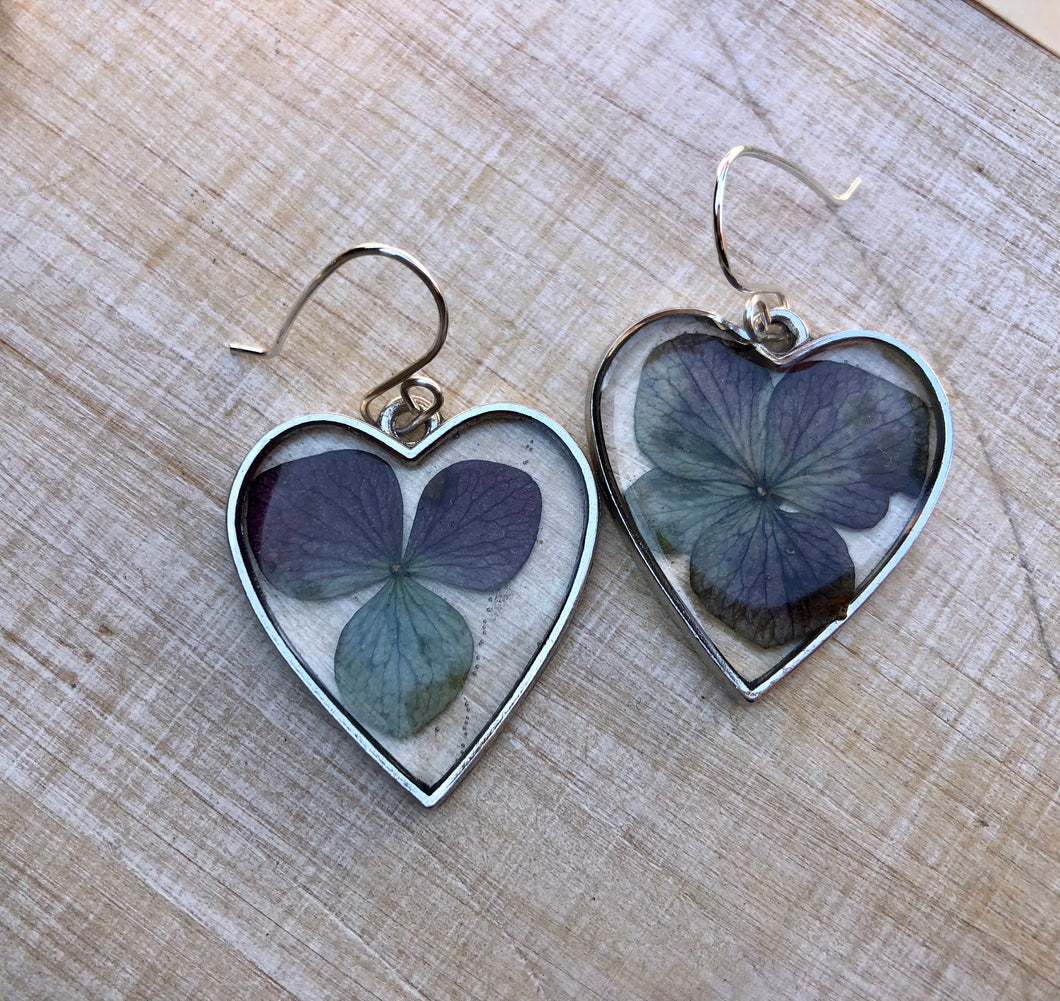 Resin earrings with dried hydrangea flowers in a silver heart frame