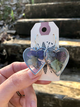 Load image into Gallery viewer, Resin earrings with dried hydrangea flowers in a silver heart frame
