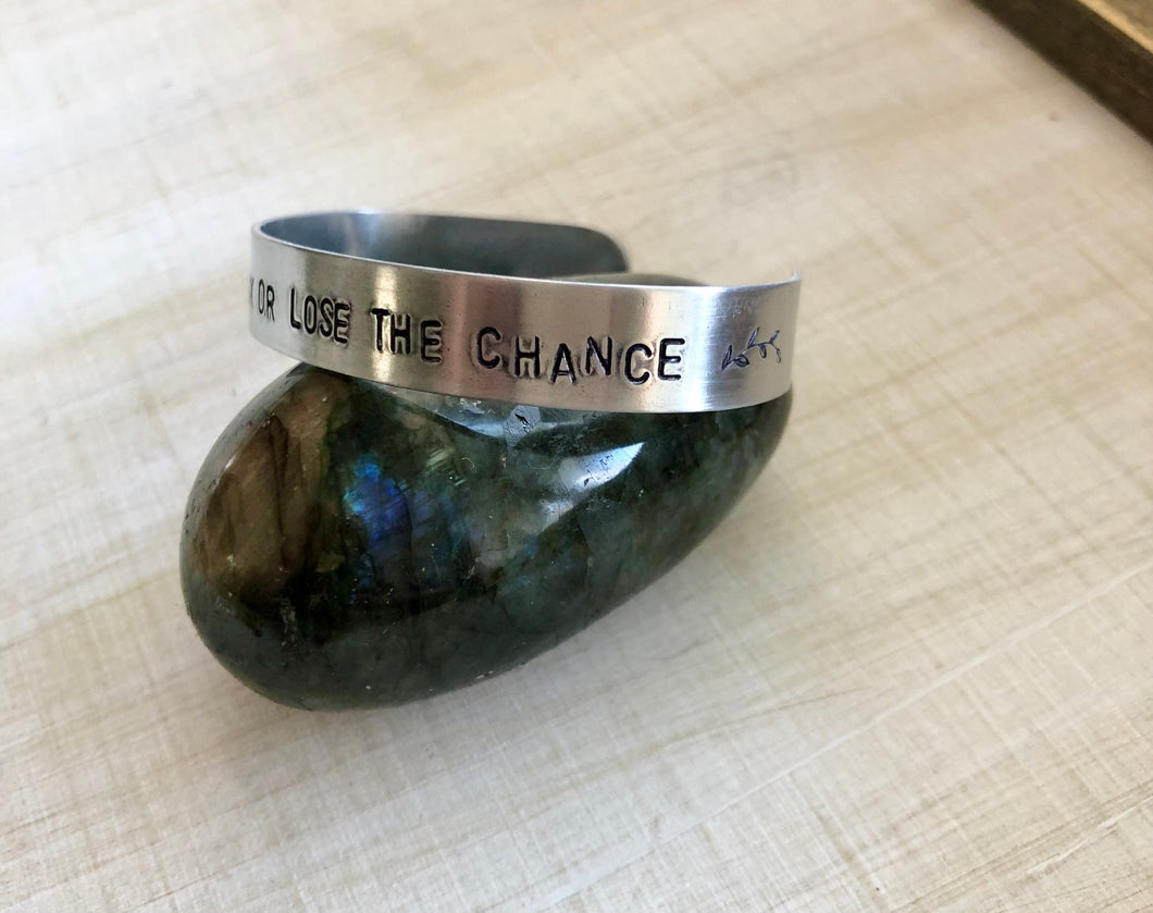 TAKE THE RISK OR LOSE THE CHANCE stamped silver cuff